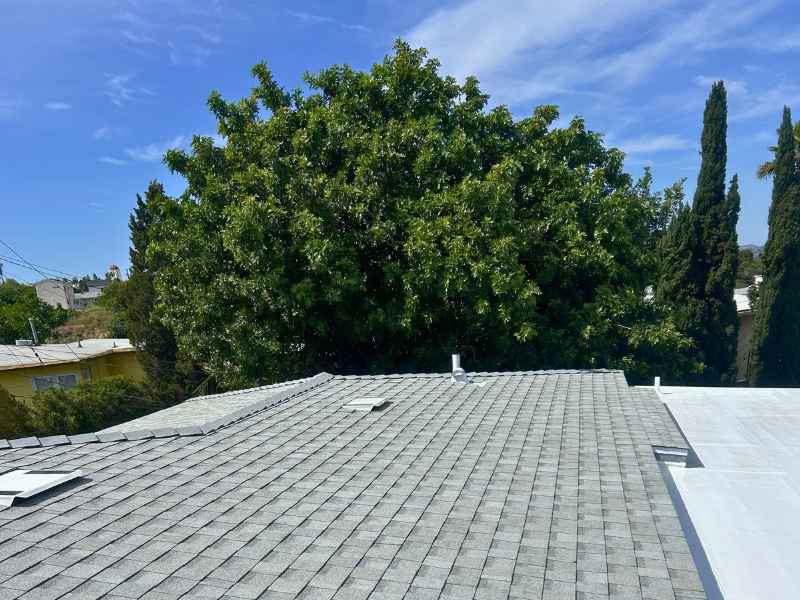 New torch-down modified bitumen roof installed on a flat roof section in San Diego