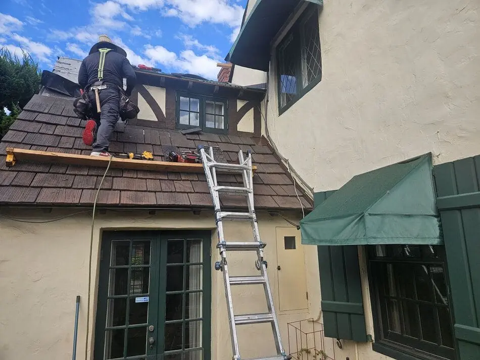 McKay technician repairing a shingle roof in San Diego