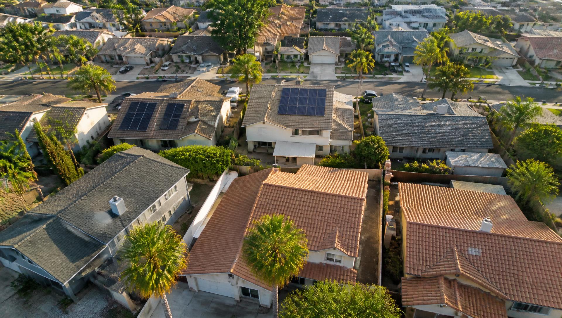 Aerial drone view of Southern California rooftops served by McKay Roofing & Solar